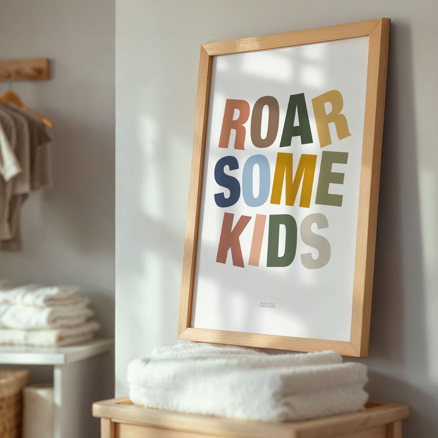 Framed poster with 'ROAR SOME KIDS' text in a home setting